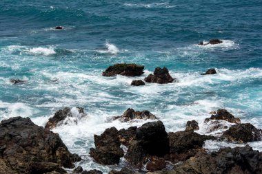 Rocks in the breakers on the coast of the Canary Island of Tenerife, Spain