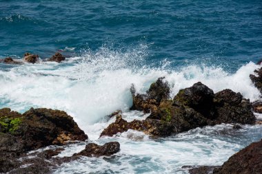 Rocks in the breakers on the coast of the Canary Island of Tenerife, Spain