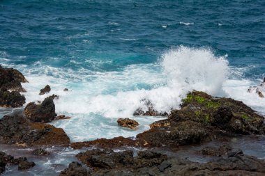 Rocks in the breakers on the coast of the Canary Island of Tenerife, Spain