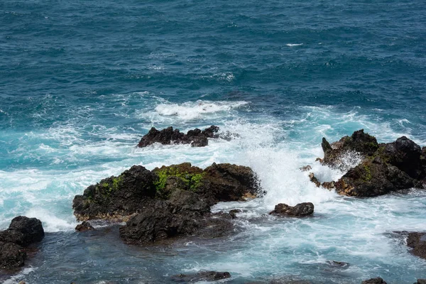 Rocks in the breakers on the coast of the Canary Island of Tenerife, Spain