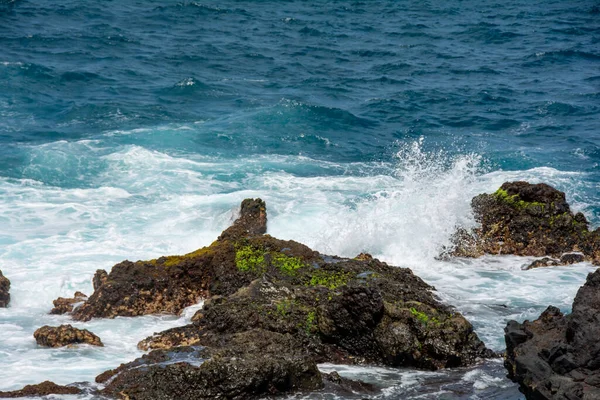 Rocks in the breakers on the coast of the Canary Island of Tenerife, Spain
