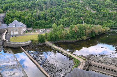 View from the Edertalsperre to the river Eder, forest  and house