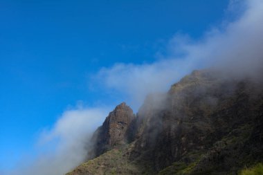 Low hanging clouds in the green Teno Mountains near Masca on the Canary Island of Tenerife, Spain