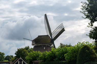 The windmill De Sluismolen  in the Netherlands clipart