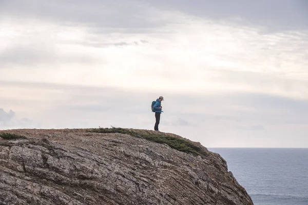 stock image Travel enthusiast enjoys his freedom in the Portuguese countryside on the Atlantic coast observing the endless sea and the shapes of the cliffs. Wandering the Fisherman Trail.