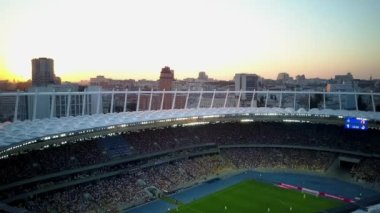 Kiev-Olympic Stadium. World Cup. Ukraine-Croatia. cityscape time of day night. The view from the top to the illuminated stadium with games and fans. Stadium