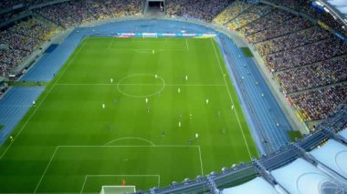 Kiev-Olympic Stadium. World Cup. Ukraine-Croatia. cityscape time of day night. The view from the top to the illuminated stadium with games and fans. Stadium