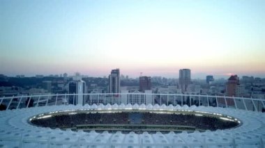 Kiev-Olympic Stadium. World Cup. Ukraine-Croatia. cityscape time of day night. The view from the top to the illuminated stadium with games and fans. Stadium