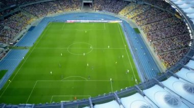 Kiev-Olympic Stadium. World Cup. Ukraine-Croatia. cityscape time of day night. The view from the top to the illuminated stadium with games and fans. Stadium