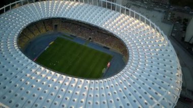 Kiev-Olympic Stadium. World Cup. Ukraine-Croatia. cityscape time of day night. The view from the top to the illuminated stadium with games and fans. Stadium