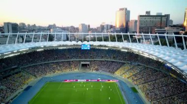 Kiev-Olympic Stadium. World Cup. Ukraine-Croatia. cityscape time of day night. The view from the top to the illuminated stadium with games and fans. Stadium