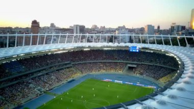 Kiev-Olympic Stadium. World Cup. Ukraine-Croatia. cityscape time of day night. The view from the top to the illuminated stadium with games and fans. Stadium