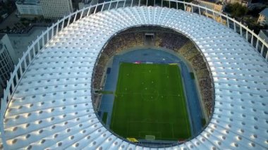 Kiev-Olympic Stadium. World Cup. Ukraine-Croatia. cityscape time of day night. The view from the top to the illuminated stadium with games and fans. Stadium