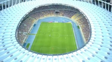Kiev-Olympic Stadium. World Cup. Ukraine-Croatia. cityscape time of day night. The view from the top to the illuminated stadium with games and fans. Stadium