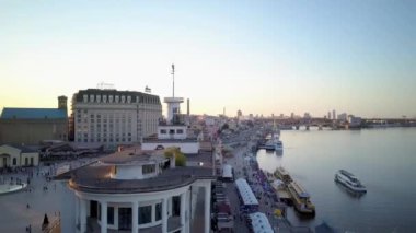 Beautiful panorama of the Hero city Kyiv, capital of Ukraine. view of the river station of the city of Kyiv. Dnieper river with bridges, beaches, ships, yachts. Many buildings and trees