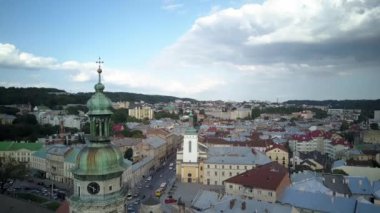 . Aerial drone of the Lviv Ukraine during a summer day with cars driving and the city skyline in the background, central part of the city of Lviv, Ukraine, drone flight 