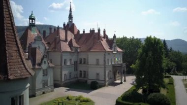  Shooting from a birds-eye view. Aerial view of castle Schonborn is one of the most beautiful and famous buildings in Carpathians, Ukraine. Eastern Carpathian Mountains, Transcarpathia