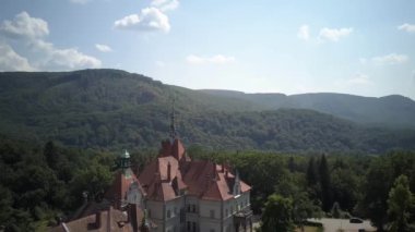  Shooting from a birds-eye view. Aerial view of castle Schonborn is one of the most beautiful and famous buildings in Carpathians, Ukraine. Eastern Carpathian Mountains, Transcarpathia