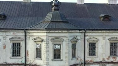 Old castle Podgortsy, Ukraine. View of the castle from above, aerial view from a drone. Podgoretsky castle. On the horizon is an old church. Architectural structure of medieval forest on a hill