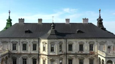 Old castle Podgortsy, Ukraine. View of the castle from above, aerial view from a drone. Podgoretsky castle. On the horizon is an old church. Architectural structure of medieval forest on a hill
