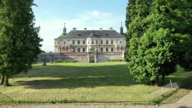 Old castle Podgortsy, Ukraine. View of the castle from above, aerial view from a drone. Podgoretsky castle. On the horizon is an old church. Architectural structure of medieval forest on a hill