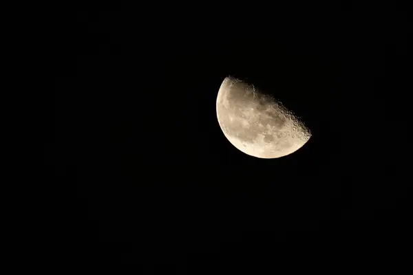 Half Moon Background The Moon is an astronomical body that orbits planet Earth, being Earth\'s only permanent natural satellite