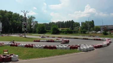 FPV, KIEV, Ukraine - April 9, 2021: race track seagull go-kart on the road Issue Drone view 4K, Kart pilot during training, Kart crossing the finish line, Rally races line track or road marking. Start