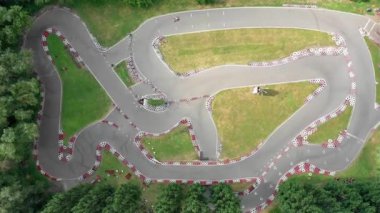 FPV, KIEV, Ukraine - April 9, 2021: race track seagull go-kart on the road Issue Drone view 4K, Kart pilot during training, Kart crossing the finish line, Rally races line track or road marking. Start