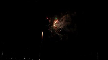 Fireworks at Night, Colorful celebration fireworks isolated on a black sky background. From below, shot of wonderful and vivid fireworks exploding. Burst. Firework. Show. New Year. Fireworks. 