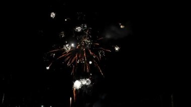 Fireworks at Night, Colorful celebration fireworks isolated on a black sky background. From below, shot of wonderful and vivid fireworks exploding. Burst. Firework. Show. New Year. Fireworks. 