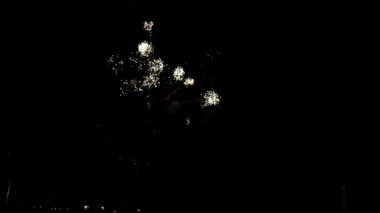 Fireworks at Night, Colorful celebration fireworks isolated on a black sky background. From below, shot of wonderful and vivid fireworks exploding. Burst. Firework. Show. New Year. Fireworks. 