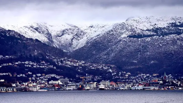 stock image Cruise in Norway. View of the fjord from the boat , view of the mountains from the boat, waterfalls, cruise ships and tender boats carrying tourists from ship to shore on a beautiful day with blue sky