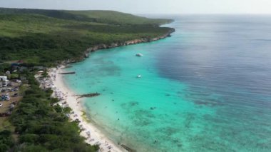 Aerial drone footage over Grote Knip in West Punt Curaca. Carribean beach drop down footage over the clear sea and sand. High quality 4k footage