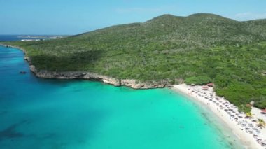 Aerial drone footage over Grote Knip in West Punt Curaca. Carribean beach drop down footage over the clear sea and sand. High quality 4k footage