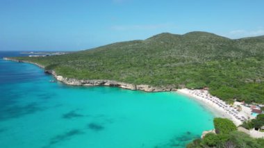Aerial drone footage over Grote Knip in West Punt Curaca. Carribean beach drop down footage over the clear sea and sand. High quality 4k footage
