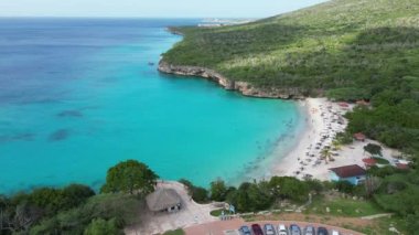 Aerial drone footage over Grote Knip in West Punt Curaca. Carribean beach drop down footage over the clear sea and sand. High quality 4k footage
