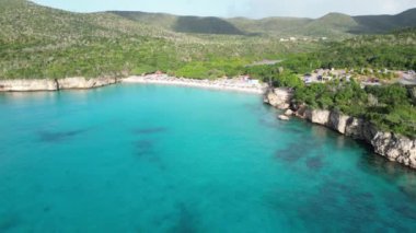 Aerial drone footage over Grote Knip in West Punt Curaca. Carribean beach drop down footage over the clear sea and sand. High quality 4k footage