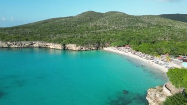 Aerial drone footage over Grote Knip in West Punt Curaca. Carribean beach drop down footage over the clear sea and sand. High quality 4k footage