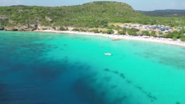 Aerial drone footage over Grote Knip in West Punt Curaca. Carribean beach drop down footage over the clear sea and sand. High quality 4k footage