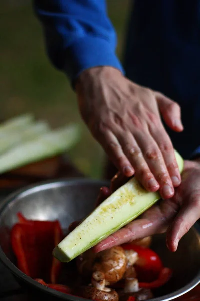 preparing vegetables for grilling, grilling vegetables, picnic, pickling vegetables, male hands, paprika, zucchini, porcini mushrooms, onion