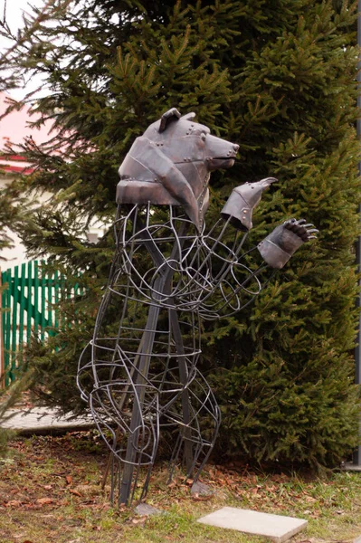 metal statue of a bear on the street