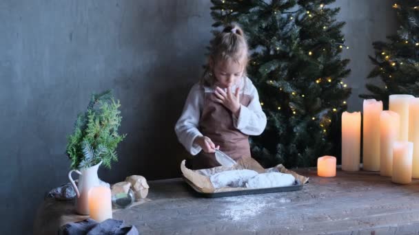 Little Girl Kitchen Prepares Christmas Stollen Sprinkling Powdered Sugar Tasting — Stock Video