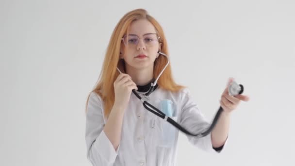 Female Doctor Stethoscope Listens Isolated White Background — Video