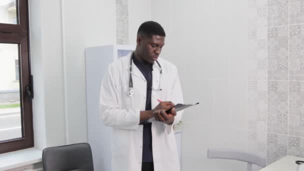 Picture Handsome Young Doctor Standing Alone His Clinic — Vídeos de Stock