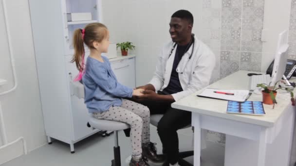 African American Male Doctor Calms Child Stroking Hands Appointment Medical — Vídeos de Stock