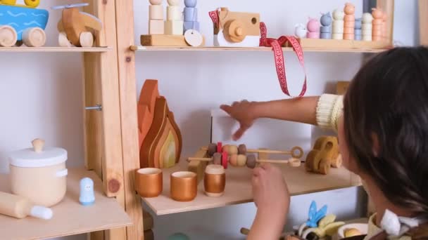 Craftsman Girl Puts Ready Made Wooden Toys Shelf Workshop — Stock Video
