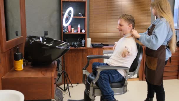 Hairdresser Girl Prepares Young Man Disabilities Beginning Haircut Barber Shop — Stock Video