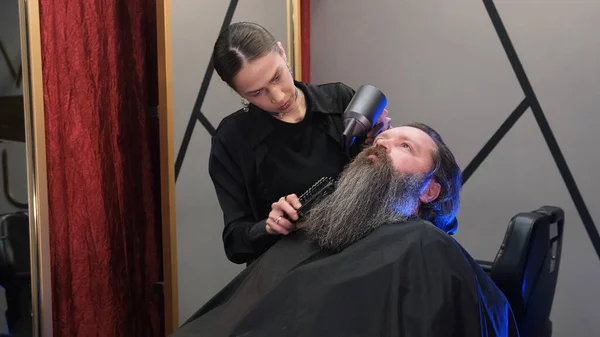 Hairdresser Girl Using Hair Dryer Dry Man Long Beard Barbershop — Stock Photo, Image