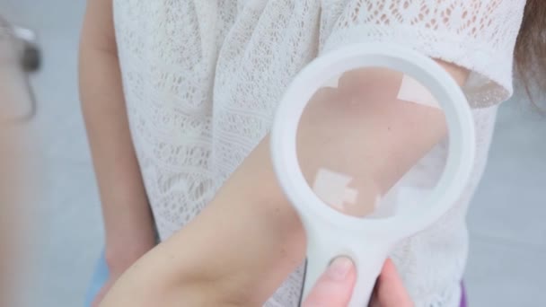Female Dermatologist Using Medical Magnifying Glass Clinic Examines Patient Skin — Stock Video