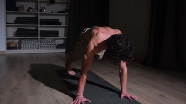 Young Athletic Man Does Yoga Performs Asanas — Stock Video